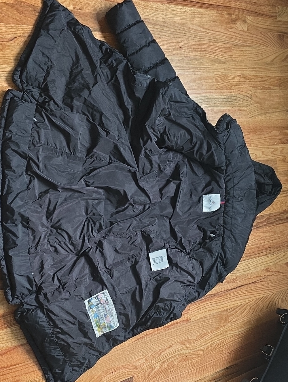Moncler Black Quilted Jacket with Colorful Cartoon Interior Patch
